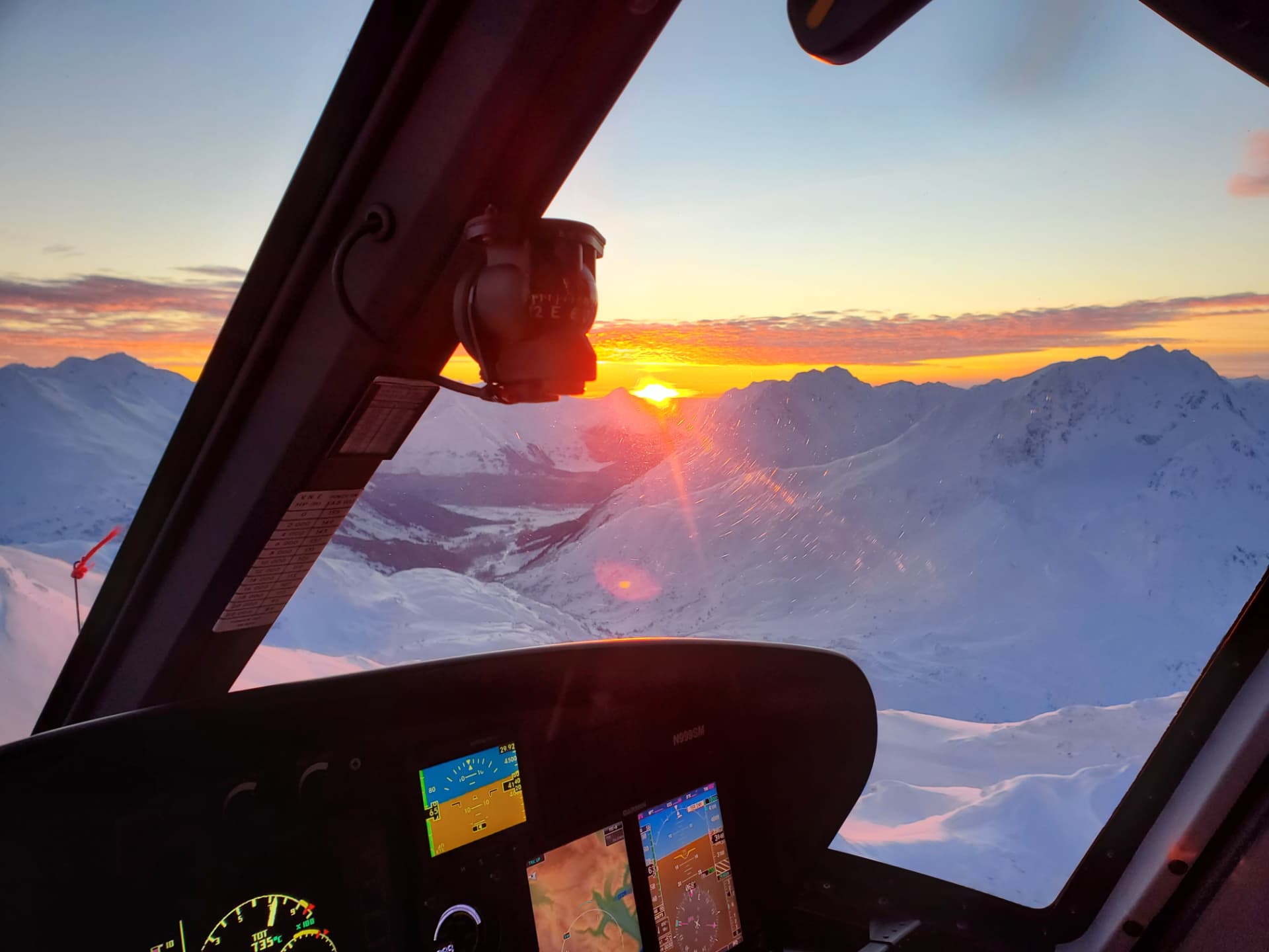 Sunset view from the helicopter cockpit