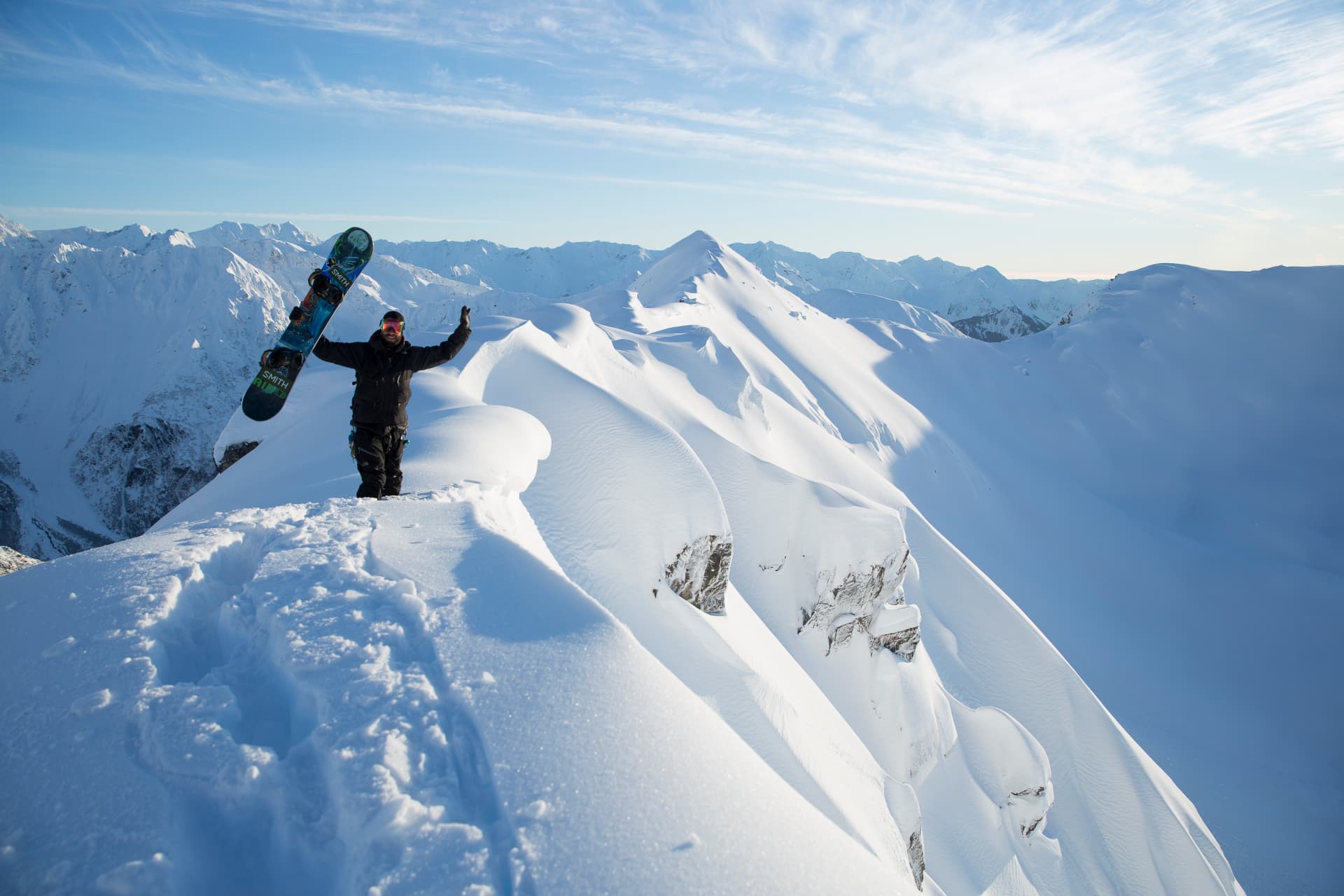 Snowboarder on a Seward ridgeline